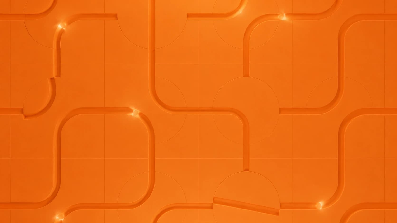 Sculpted orange pathways forming an interconnected architectural pattern